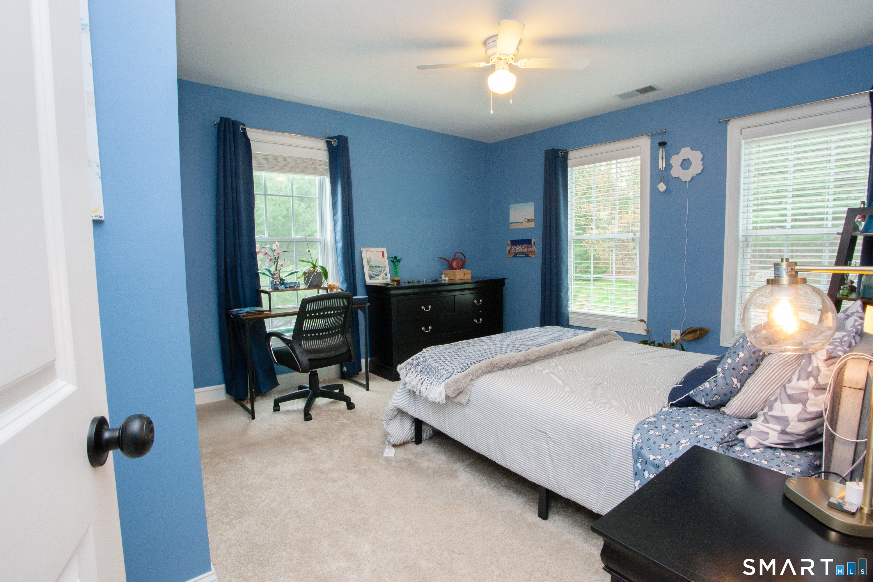 490 New Road Avon, CT 06001 - Photo 21 of 30 a bedroom with a bed and a chandelier
