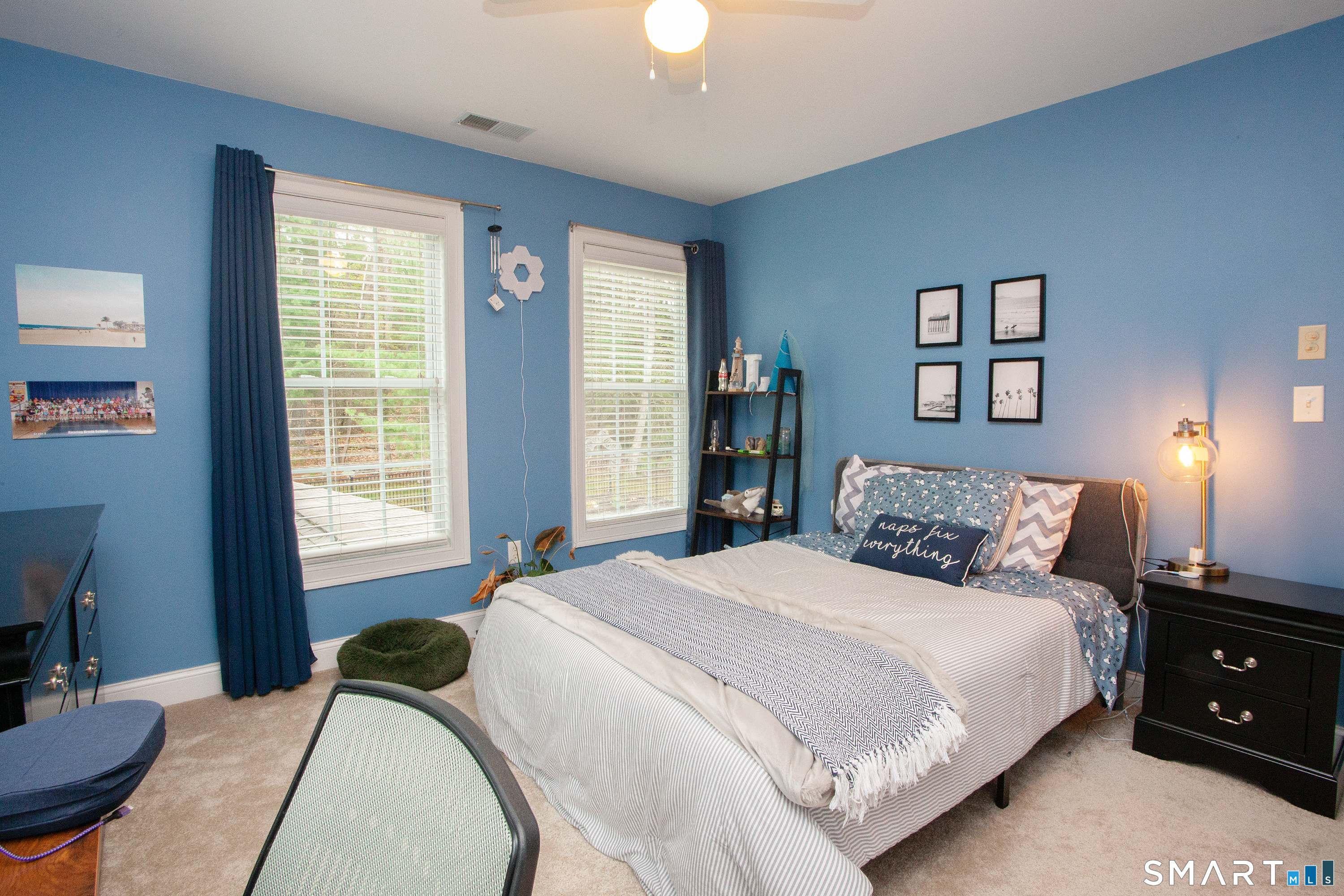 490 New Road Avon, CT 06001 - Photo 22 of 30 a bedroom with a bed and a lamp