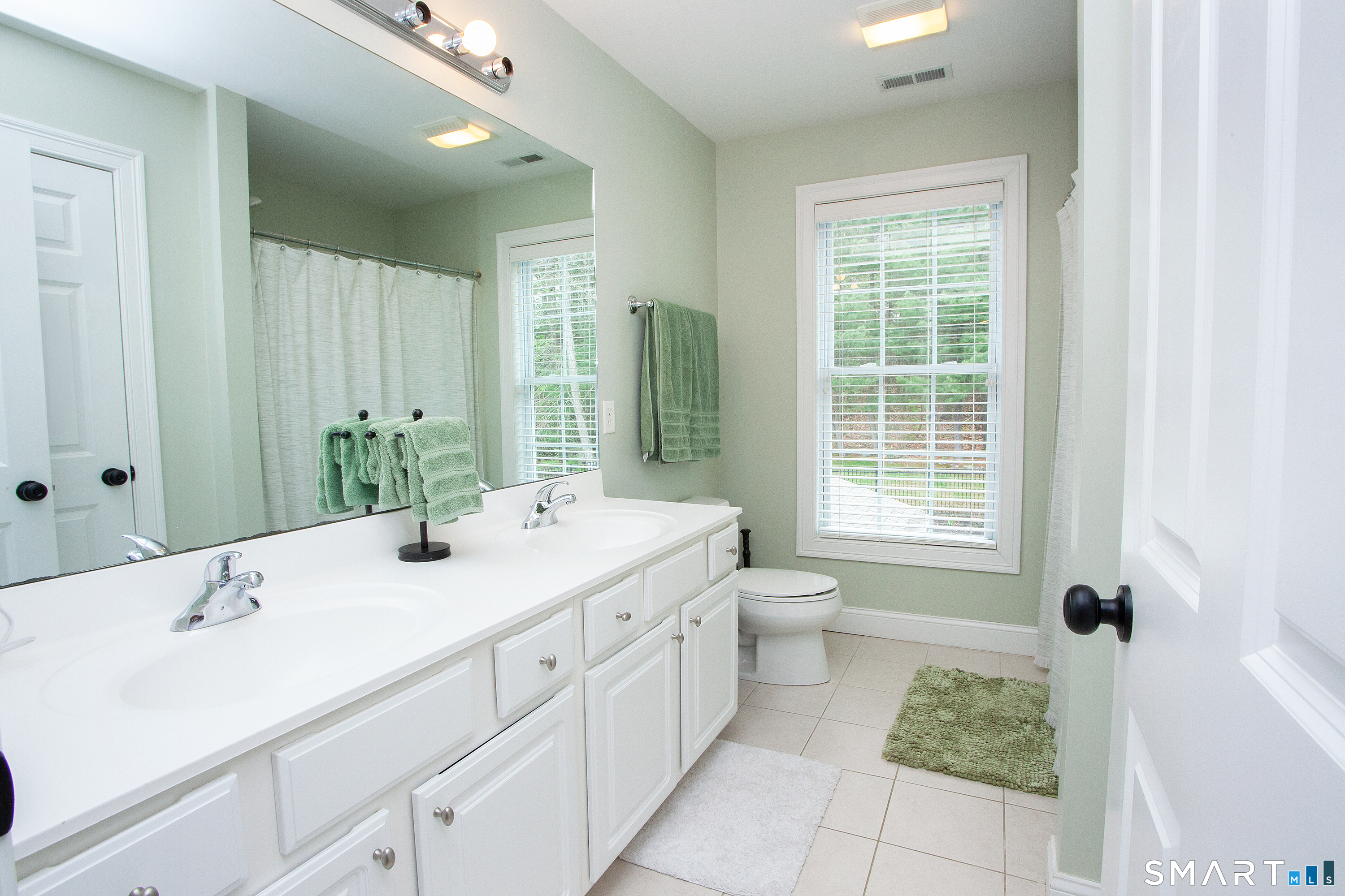 490 New Road Avon, CT 06001 - Photo 23 of 30 a spacious bathroom with a tub sink and mirror
