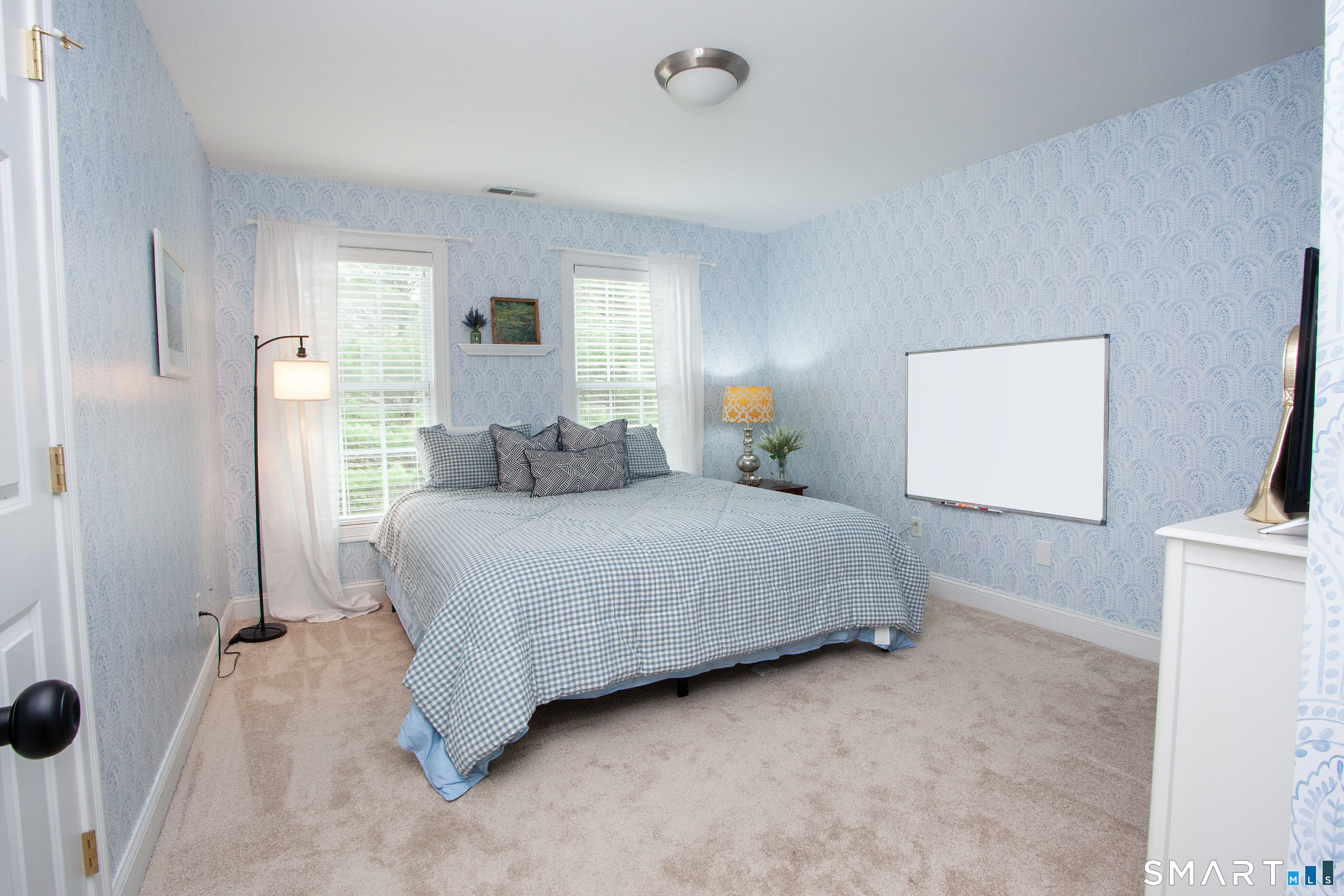 490 New Road Avon, CT 06001 - Photo 24 of 30 a bedroom with a bed and a flat screen tv