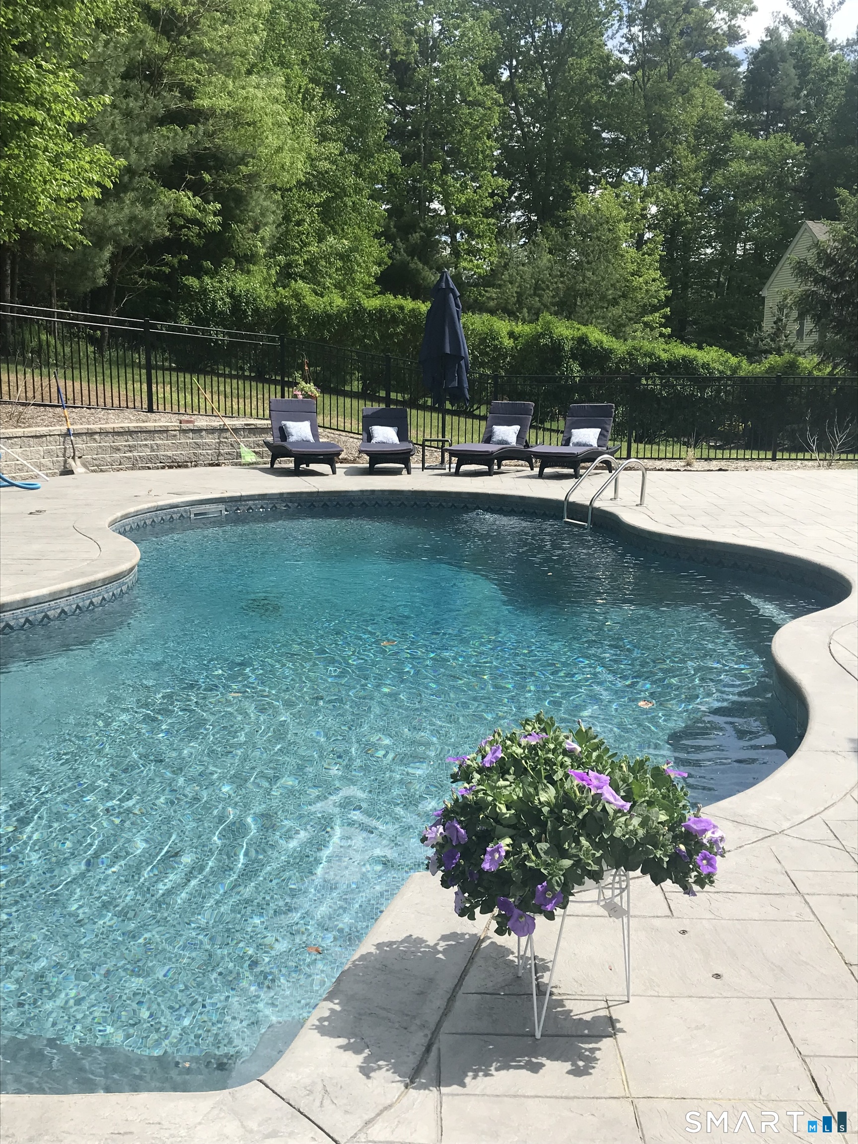 490 New Road Avon, CT 06001 - Photo 27 of 30 a view of a garden with lawn chairs