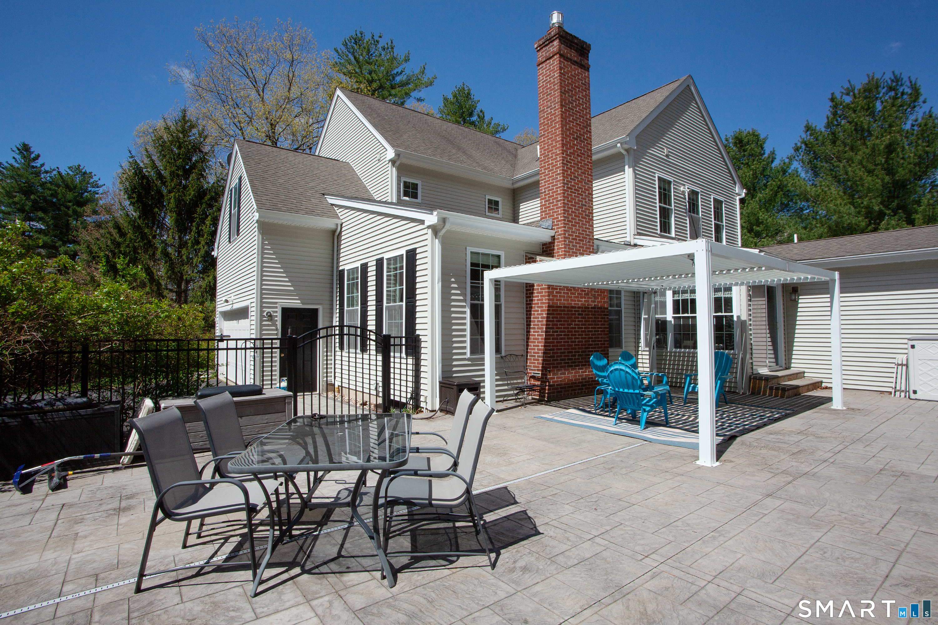 490 New Road Avon, CT 06001 - Photo 3 of 30 a view of a house with backyard sitting area and porch
