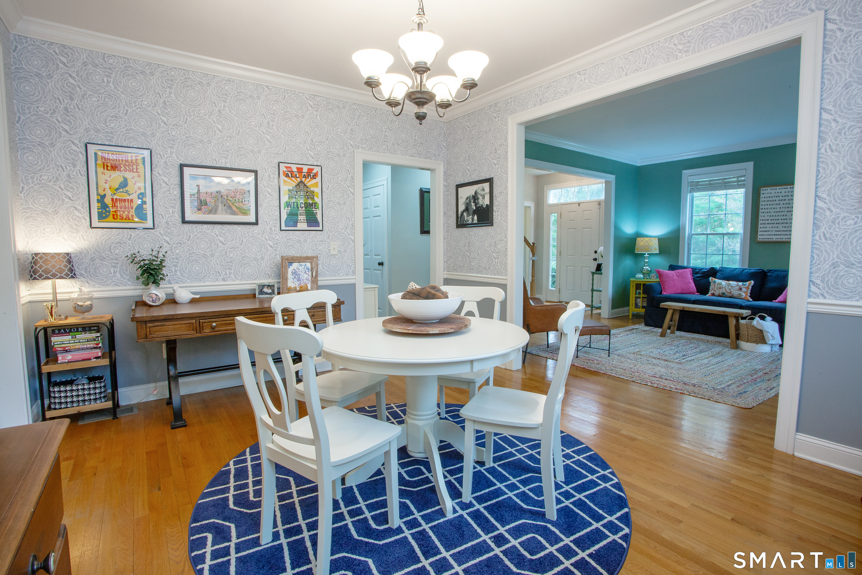 490 New Road Avon, CT 06001 - Photo 10 of 30 a view of a dining room with furniture wooden floor and chandelier