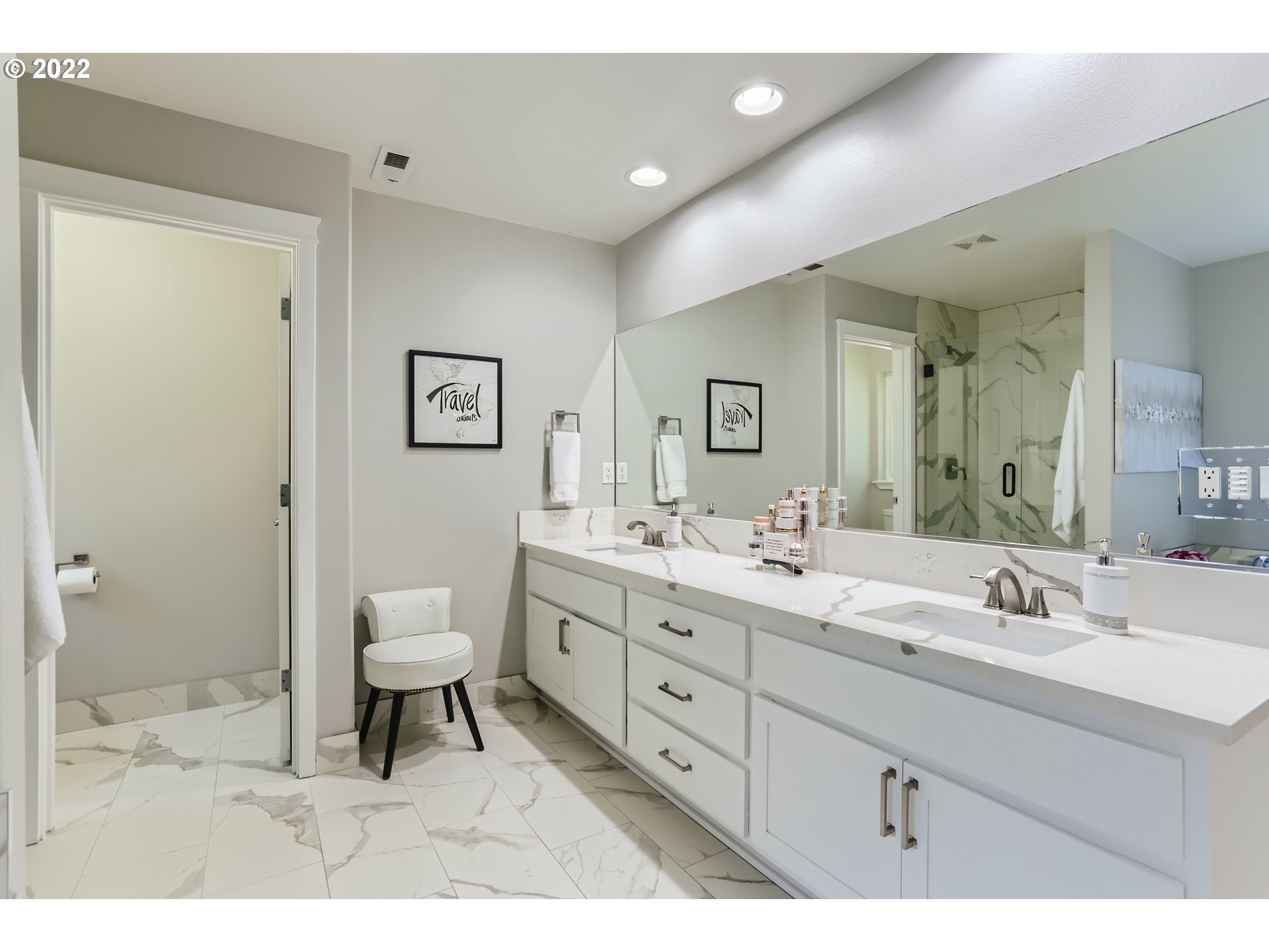 16603 Southwest 134th Terrace Portland, OR 97224 - Photo 18 of 30 a spacious bathroom with a double vanity sink mirror and toilet