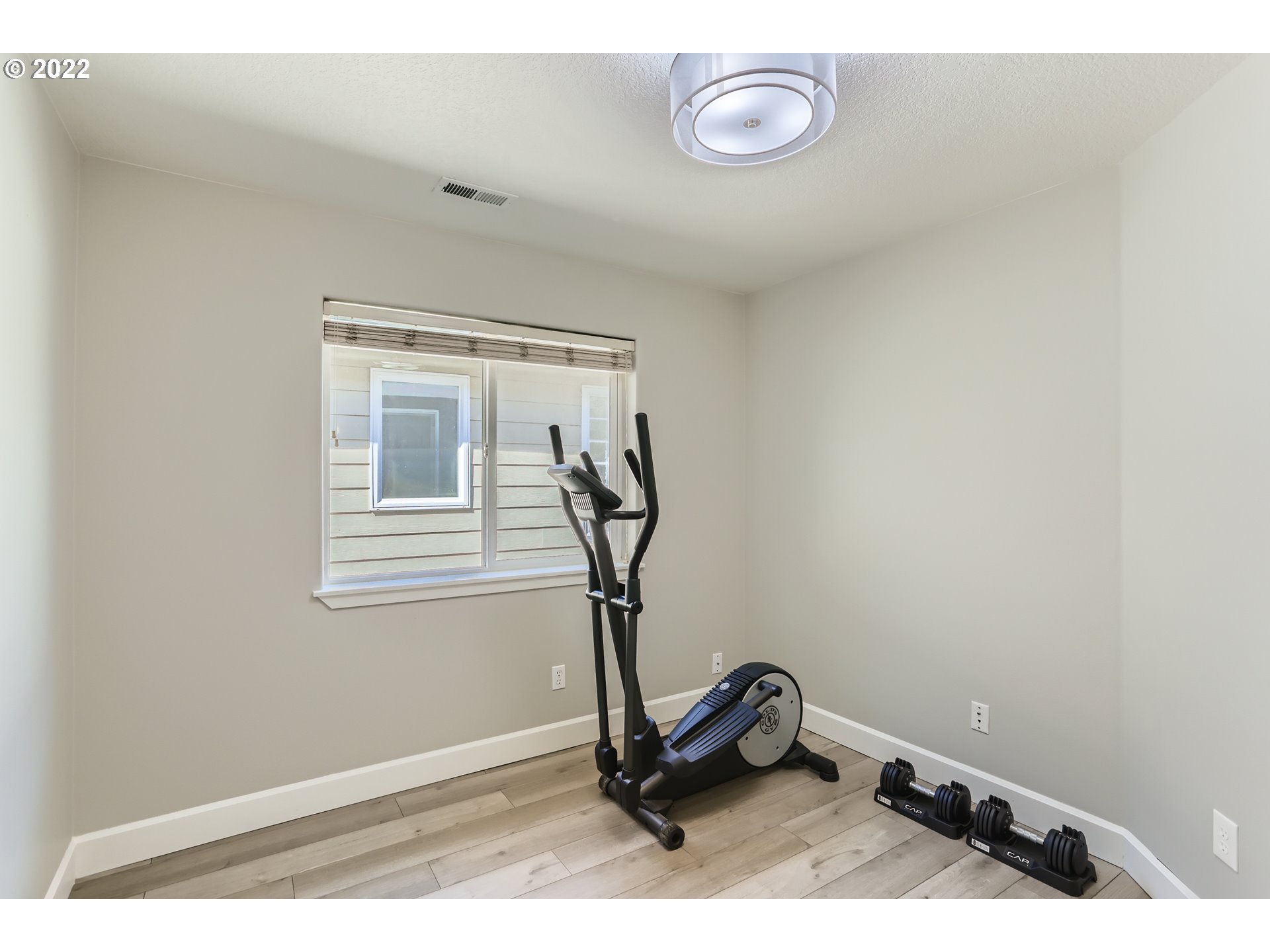 16603 Southwest 134th Terrace Portland, OR 97224 - Photo 23 of 30 a room with gym equipment and windows
