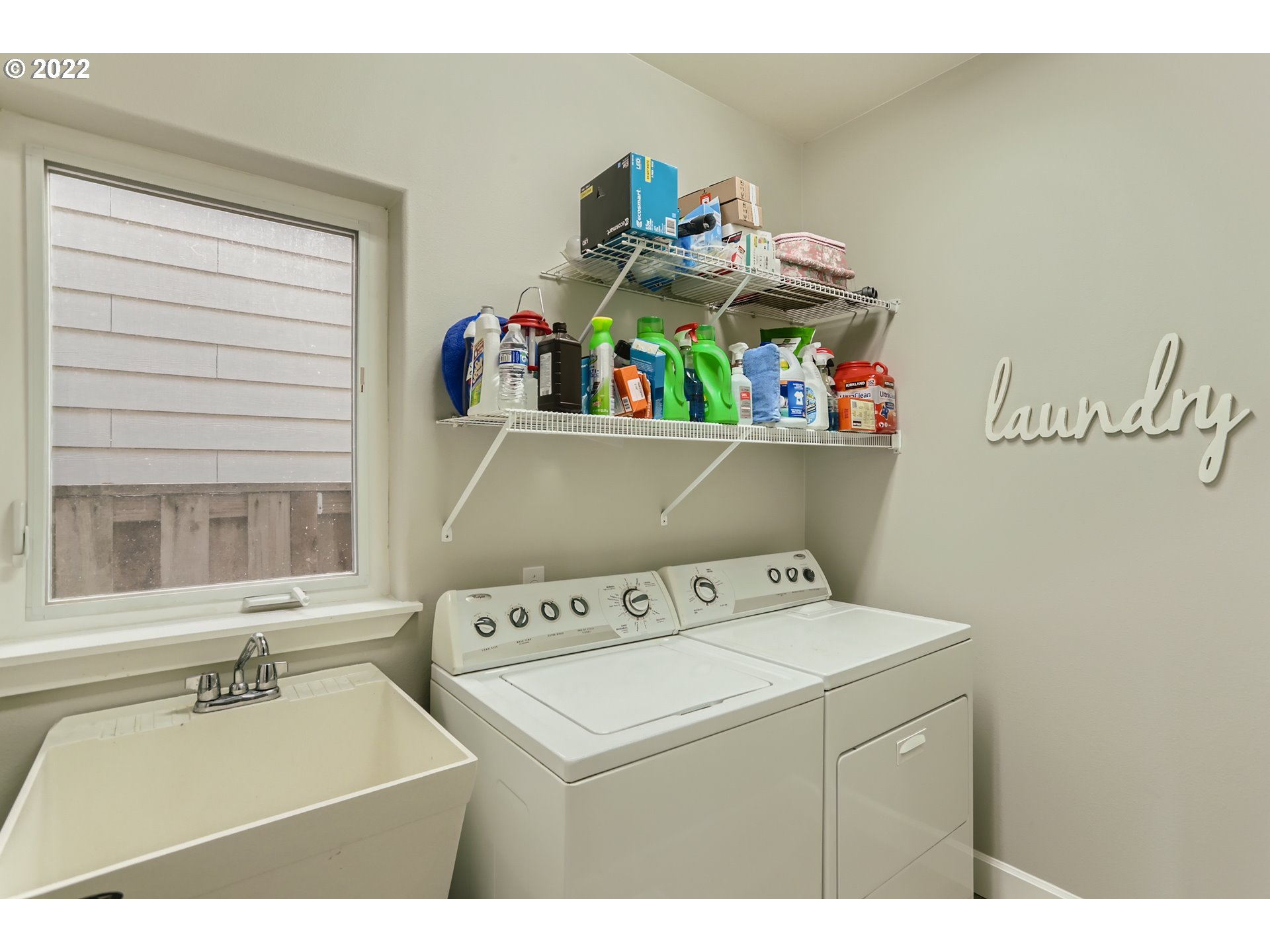 16603 Southwest 134th Terrace Portland, OR 97224 - Photo 27 of 30 a utility room with dryer washer and wooden floor