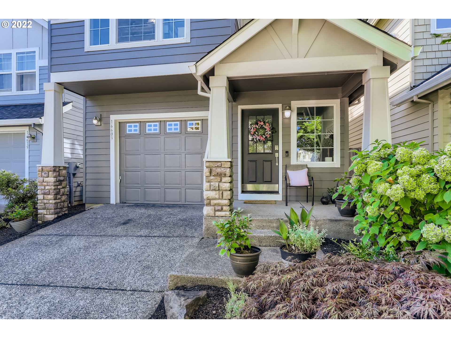 16603 Southwest 134th Terrace Portland, OR 97224 - Photo 4 of 30 a front view of a house with a yard