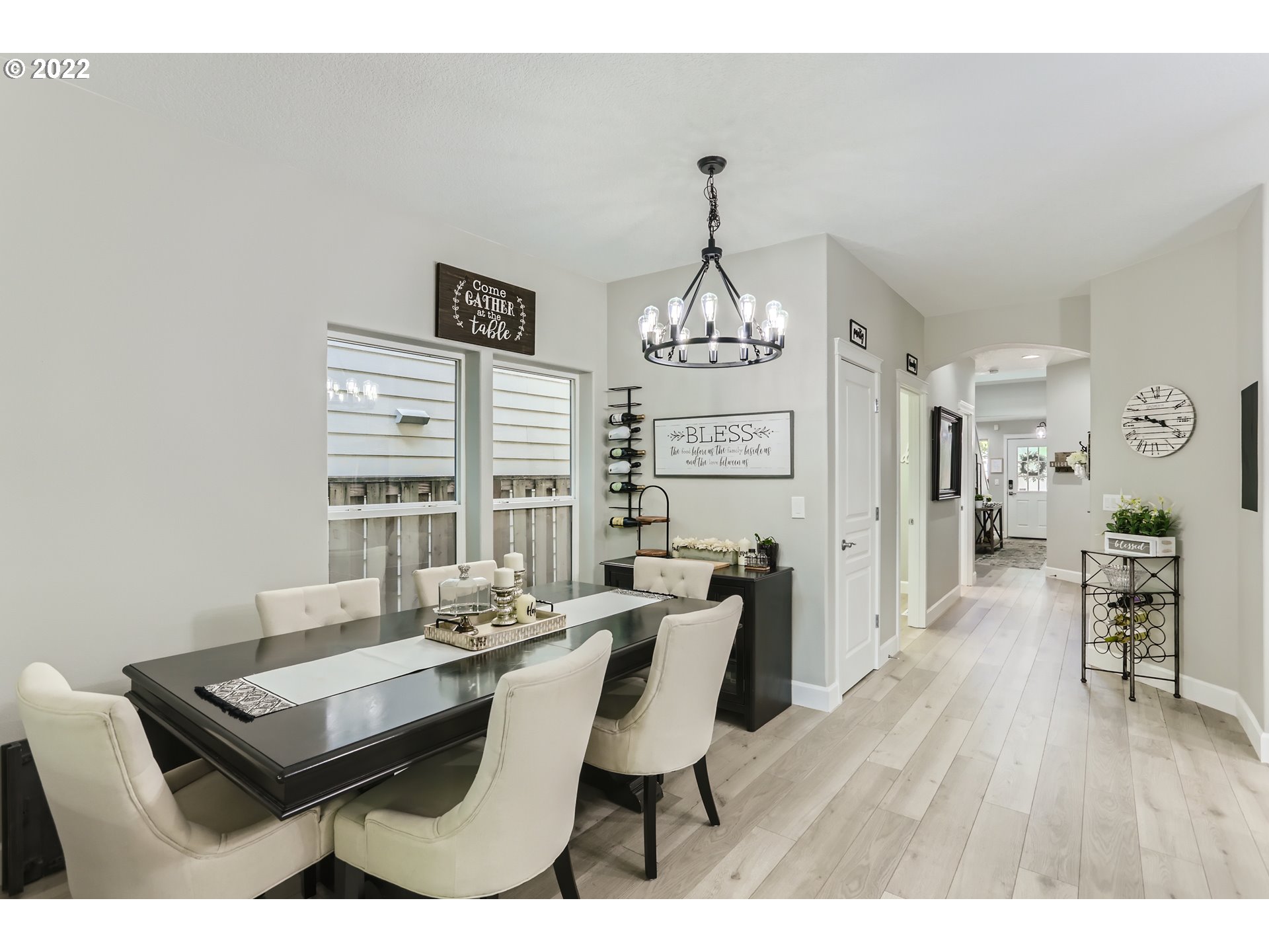 16603 Southwest 134th Terrace Portland, OR 97224 - Photo 9 of 30 a dining room with furniture a chandelier and wooden floor