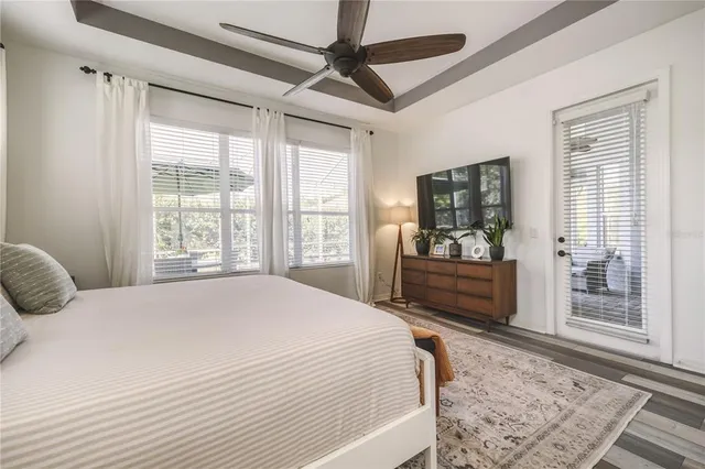 a bedroom with a large bed and a window