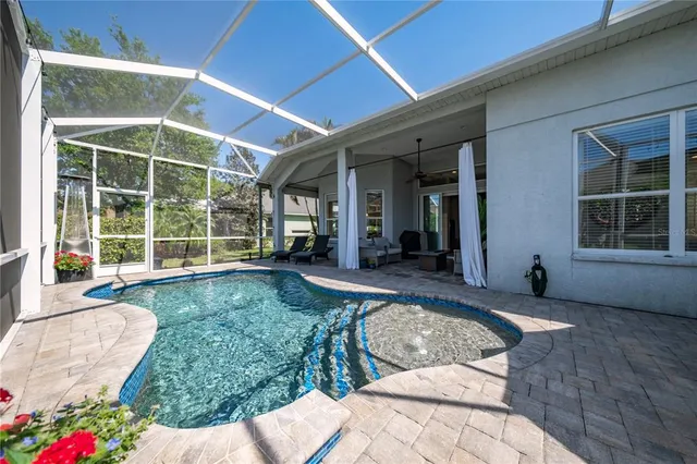 a view of swimming pool with outdoor seating