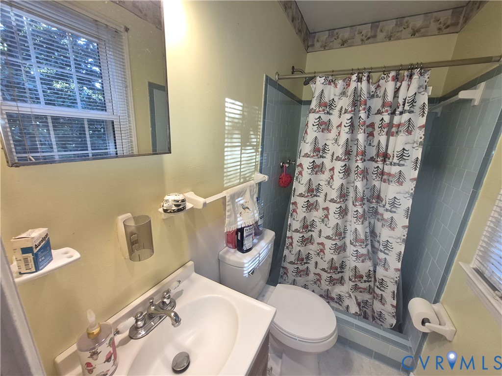 3818 Cedar Grove Road Richmond, VA 23235 - Photo 14 of 20 a bathroom with a sink toilet and shower