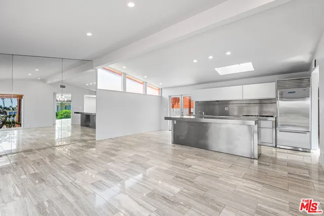 a view of kitchen with cabinets and wooden floor