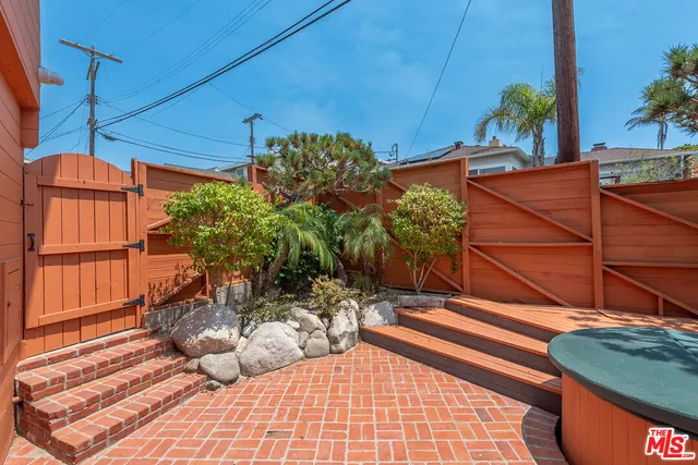 a backyard of a house with sitting area