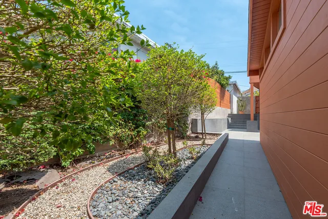 a view of front door and potted plants