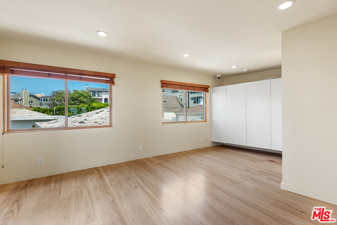 7220 Rindge Avenue Playa del Rey, CA 90293 - Photo 43 of 53 a view of an empty room with wooden floor and window