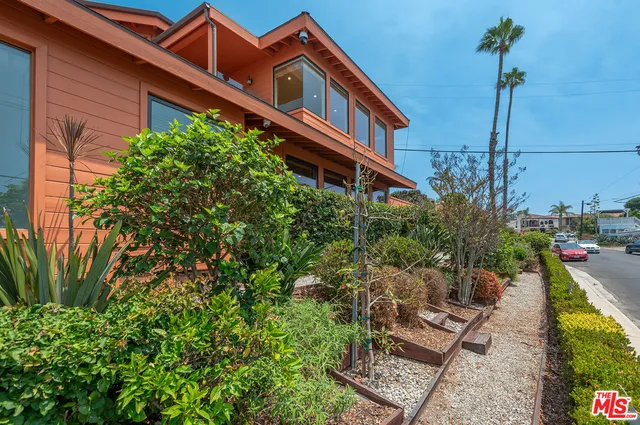 a house view with a garden space