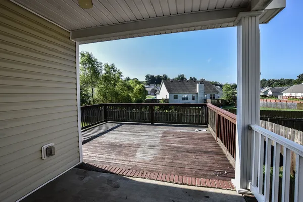 a view of balcony with wooden floor