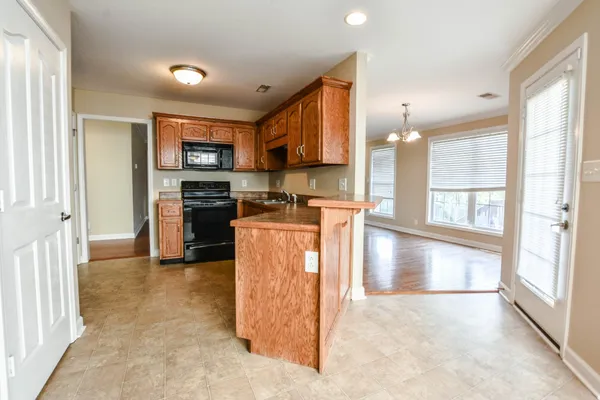 a view of a kitchen with a sink and cabinets