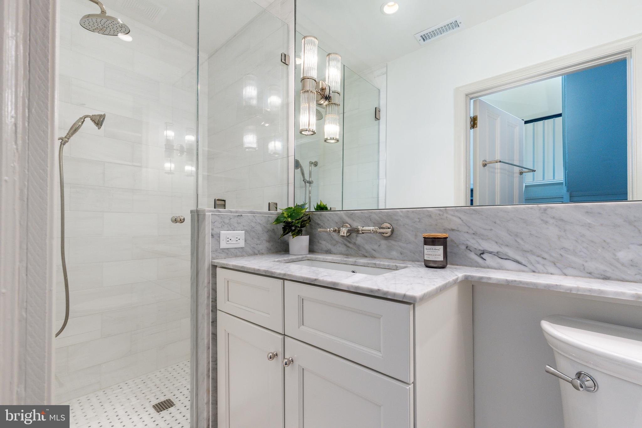 632 Spruce Street Philadelphia, PA 19106 - Photo 62 of 88 a bathroom with a granite countertop sink mirror and a shower