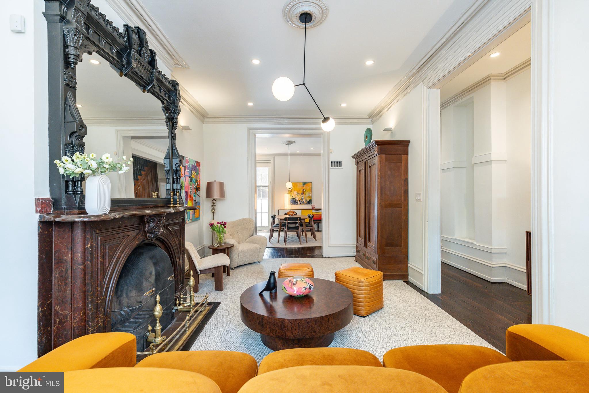 632 Spruce Street Philadelphia, PA 19106 - Photo 10 of 88 a living room with furniture a fireplace and a chandelier