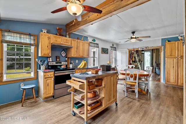 a kitchen with stainless steel appliances granite countertop a stove and a refrigerator