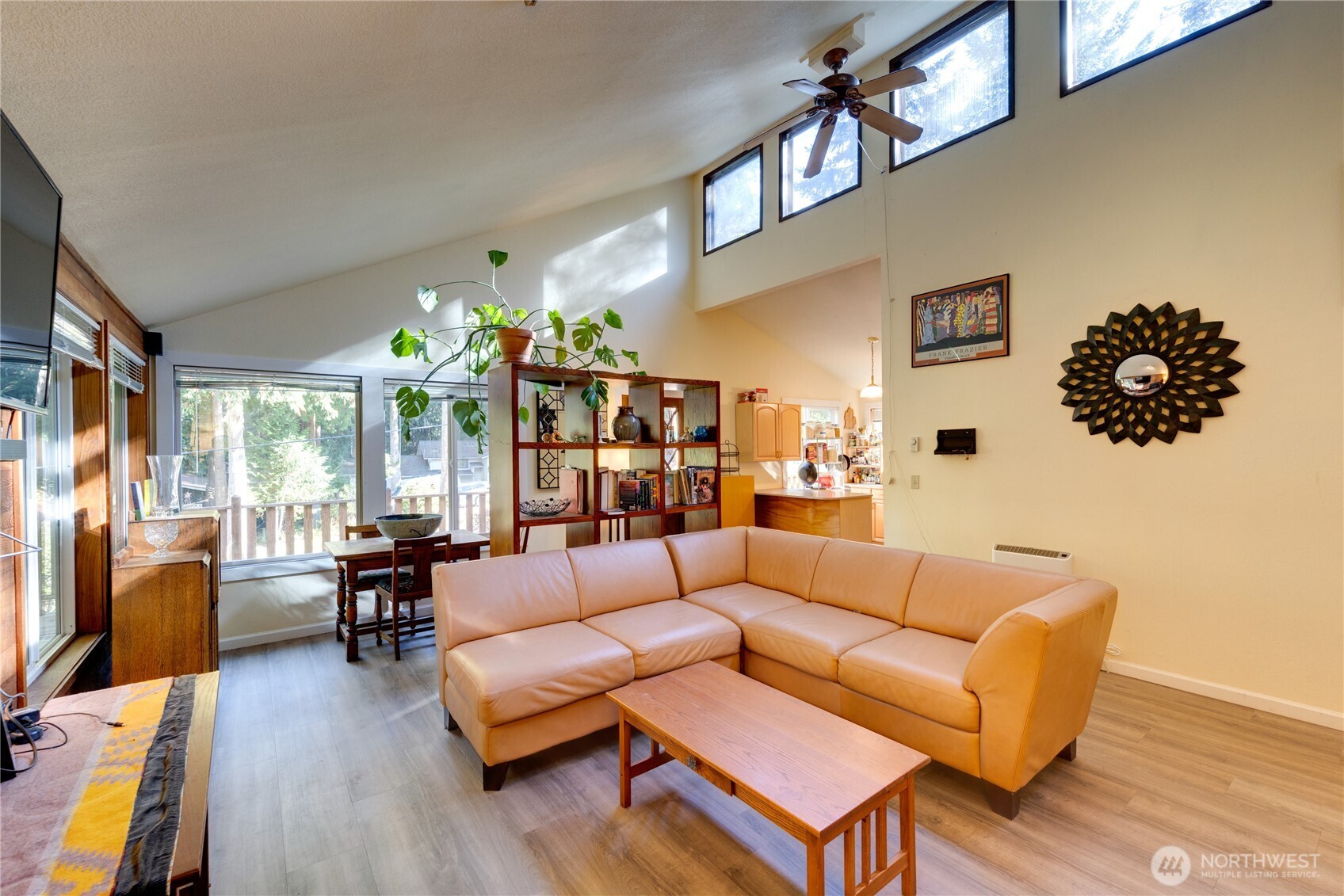2872 Hi Crest Road Langley, WA 98260 - Photo 11 of 33 a living room with furniture flower pot and a large window