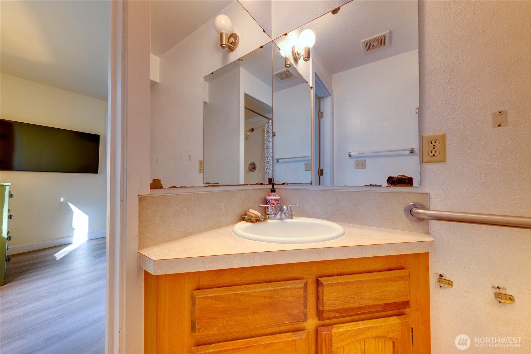 2872 Hi Crest Road Langley, WA 98260 - Photo 28 of 33 a bathroom with a sink and a mirror
