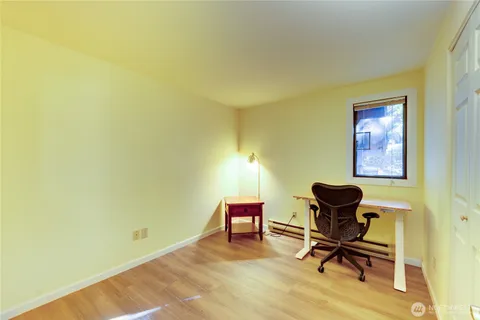 a workspace with furniture and a window