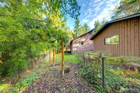 a backyard of a house with lots of green space