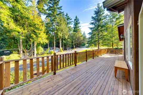 a view of deck with wooden floor and fence