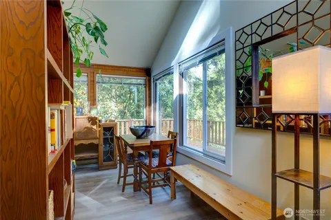 a view of a dining room with furniture window and outside view
