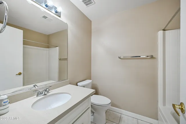 a bathroom with a sink toilet and vanity