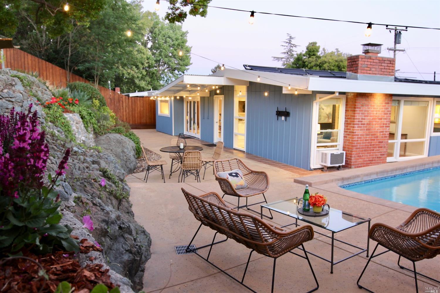 572 Las Colindas Road San Rafael, CA 94903 - Photo 1 of 1 a view of a patio with table and chairs and potted plants