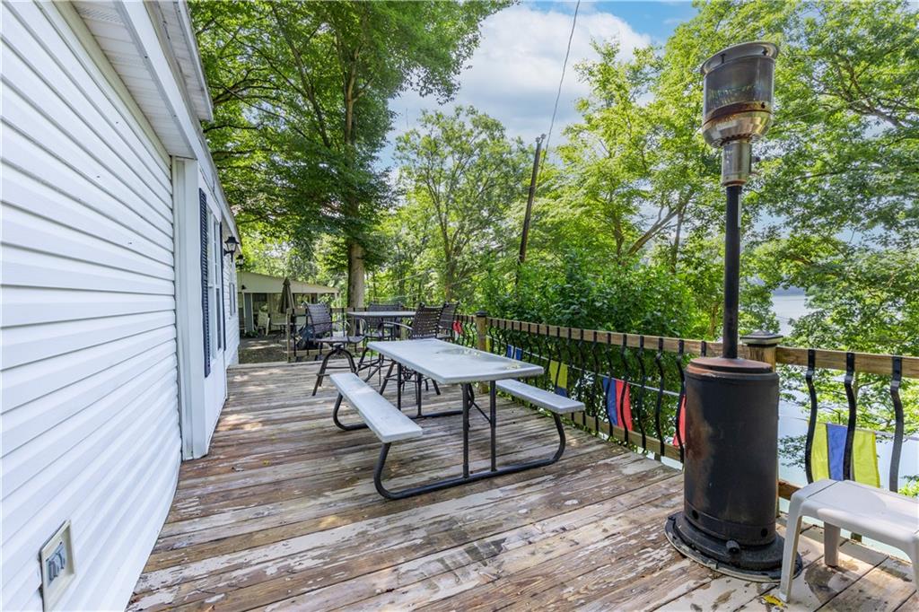 2675 Lakeview Road Confluence, PA 15424 - Photo 5 of 25 a view of a chairs and table on the wooden deck