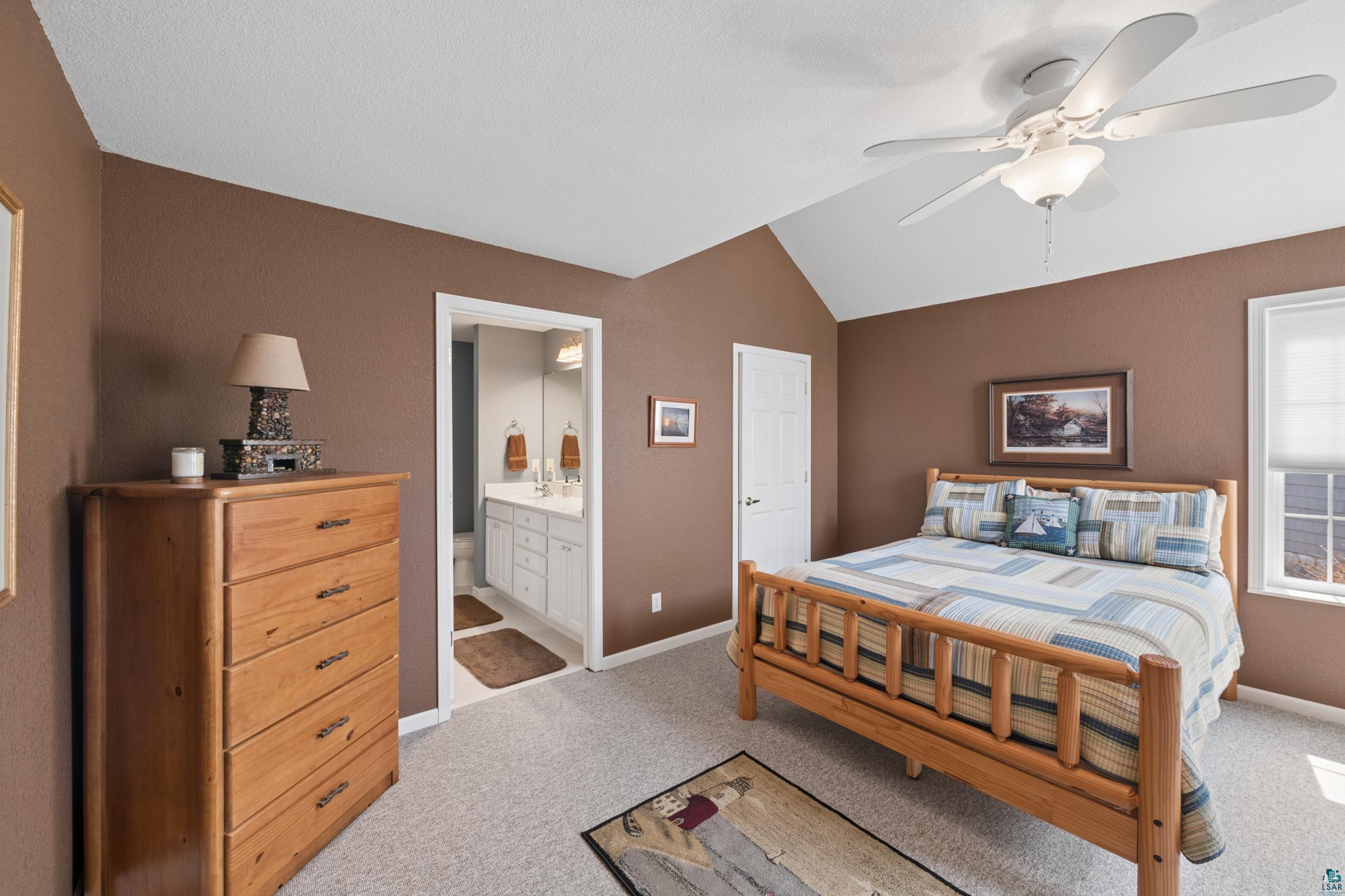 34590 Bay View Road, Unit 801 Bayfield, WI 54814 - Photo 12 of 36 Interior room with vaulted ceiling and ceiling fan