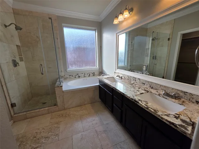 a bathroom with a granite countertop sink mirror and shower