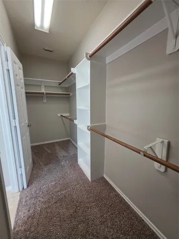 a view of storage and utility room with closet
