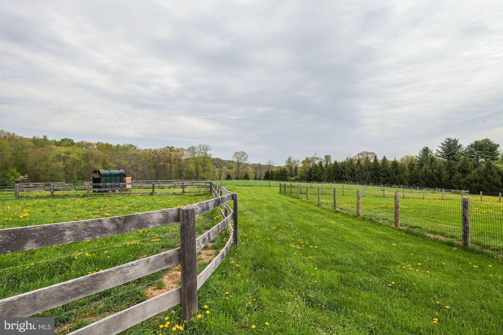 4924 Old Quarter Road Upperco, MD 21155 - Photo 24 of 28 Exterior (Rear) paddocks with oak board fences