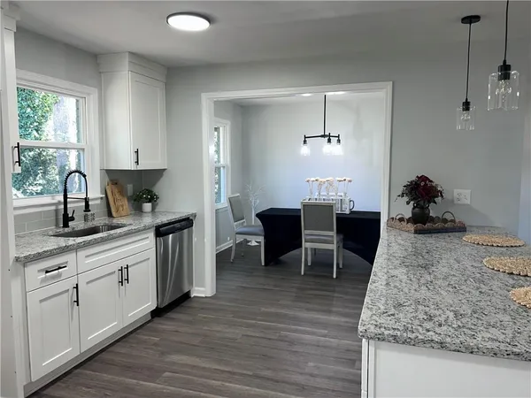 a bedroom with a bed and chandelier fan