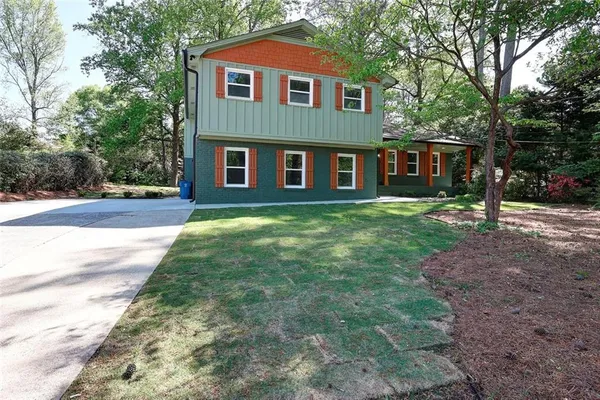 a front view of a house with a yard
