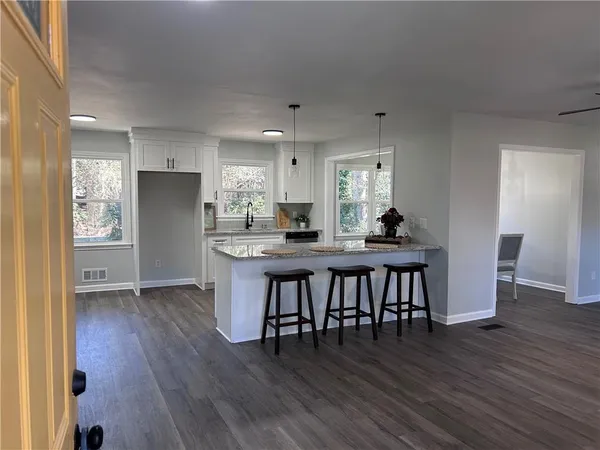 a view of a dining room with furniture window and outside view