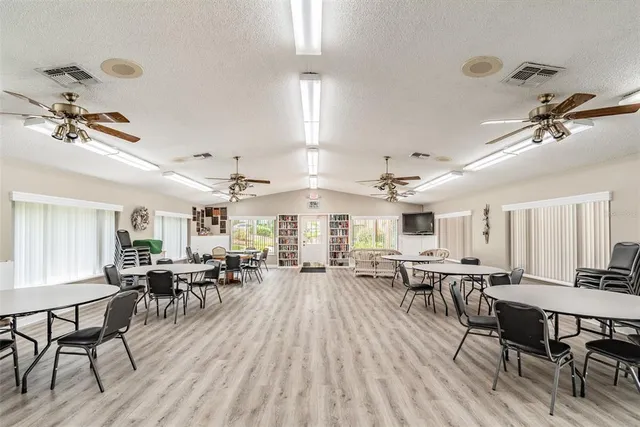 a living room with lots of furniture and a wooden floor