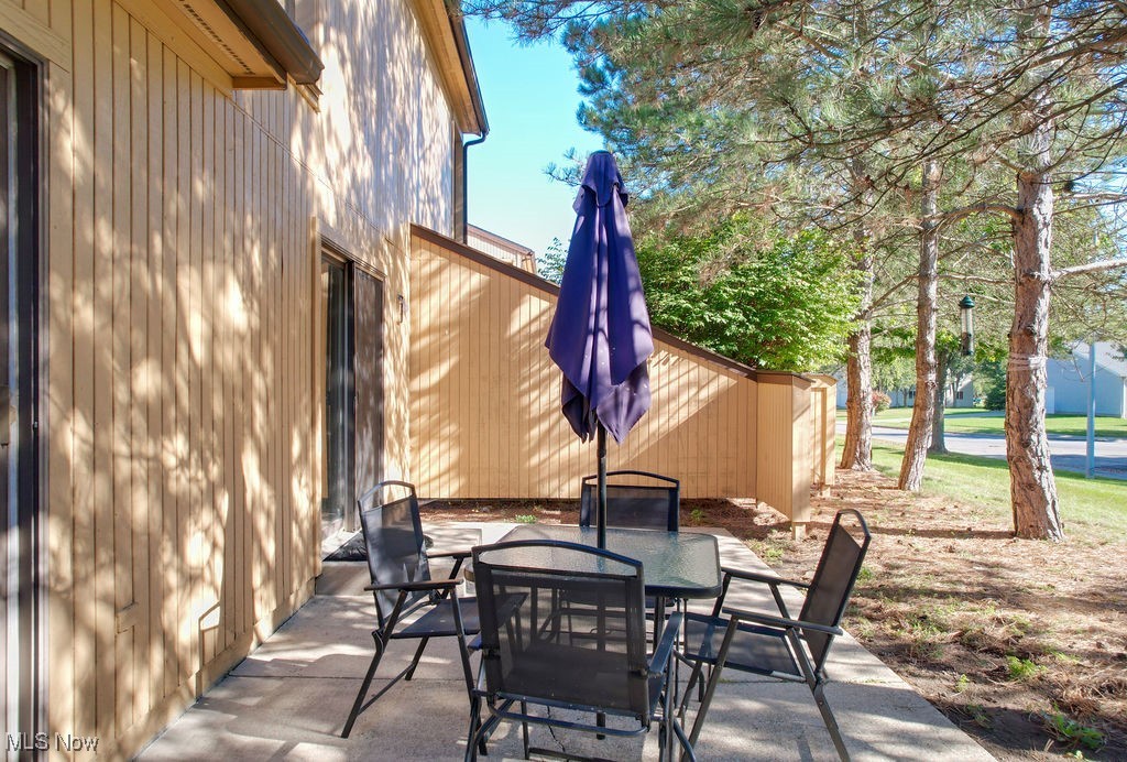 1426 Loop Road, Unit 1426 Kent, OH 44240 - Photo 32 of 40 View of patio / terrace featuring outdoor dining area.