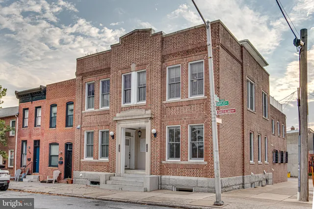 a front view of a building with a street