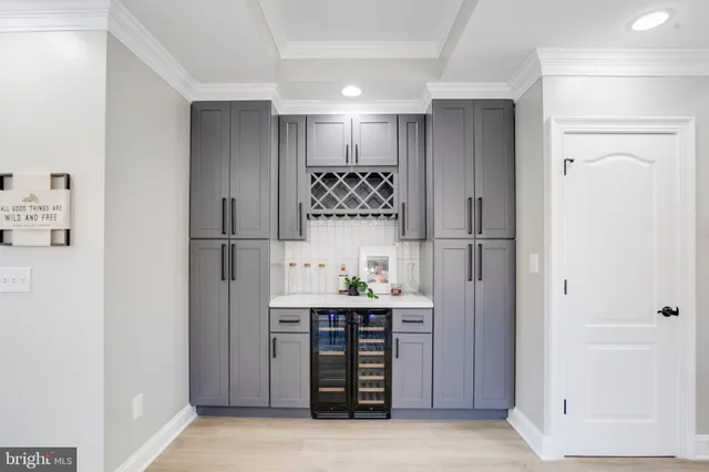 a kitchen with a refrigerator a stove top oven and a refrigerator