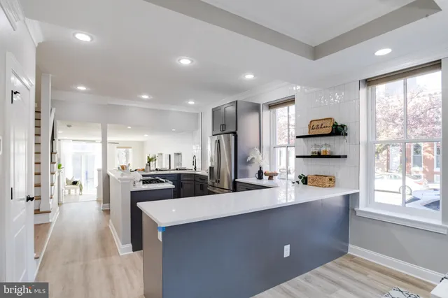 a kitchen with a stove and a sink