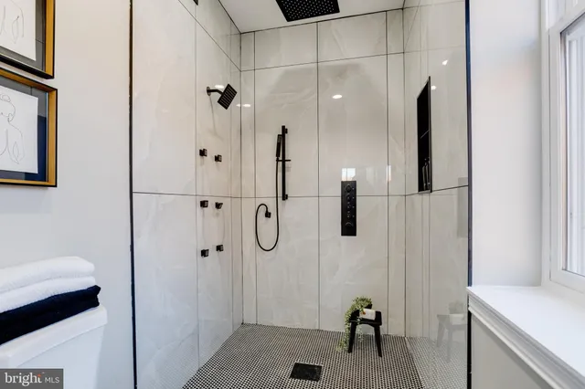 a bathroom with a bathtub and shower