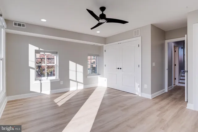 a bedroom with bed and a window