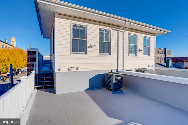 a front view of a building with street view