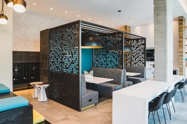 a living room with furniture fireplace and a large window